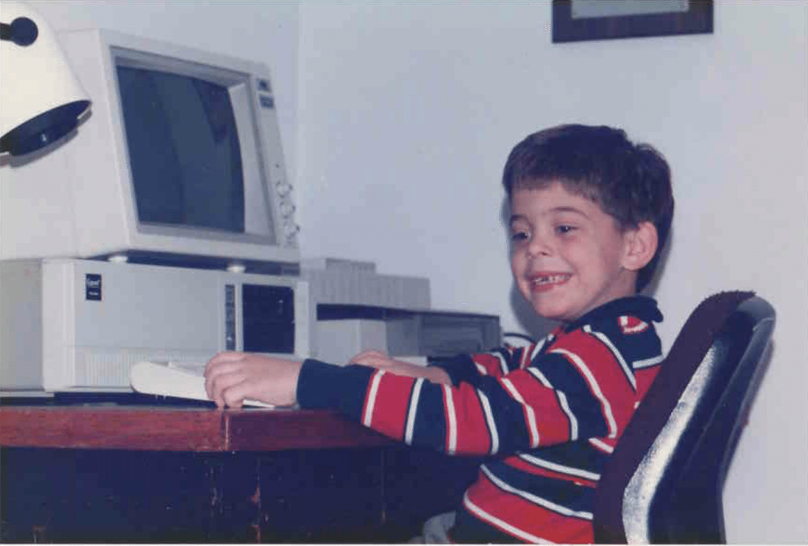 photo of child gavin in 1982 sitting infront of a computer at the time